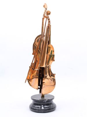 sculpture of a violin on a marble base with a white background