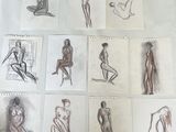sketches of a woman sitting on a chair in front of a mirror