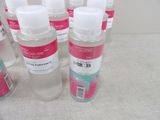 several bottles of hand sanitizer sitting on a table