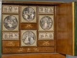 a wooden cabinet with pictures of people in it