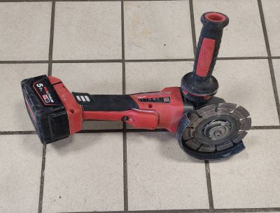 an image of a drill on the floor of a bathroom