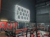 a gym with a lot of equipment in the room