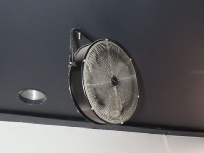 a fan that is on the side of a wall