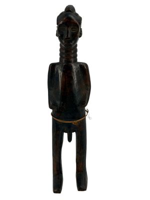 an old wooden statue of a man with a hat on his head