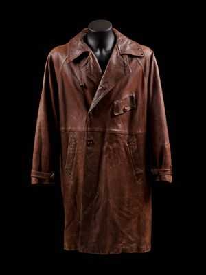 a brown leather coat on a mannequin head