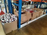 many boxes of sodas and cans in a warehouse