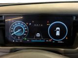 the dashboard of a car with a digital display on it