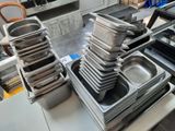 several trays of food are stacked on top of each other on a table