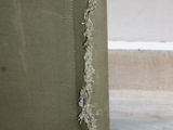 a piece of fabric that has been torn off of a piece of luggage
