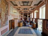 a large room with a lot of paintings on the walls