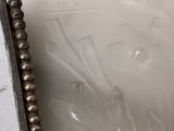 a picture of a glass vase with a beaded edge