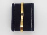 a close up of a black velvet case with a gold clasp