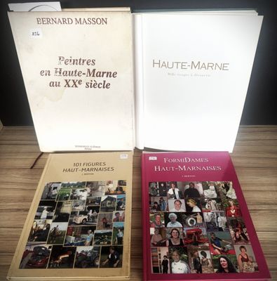 two books are sitting on a table next to each other