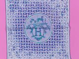 a blue and white square with a cross stitch design on it