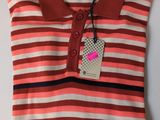 a pink and brown striped polo shirt with a tag on it