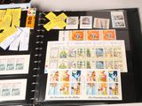 a black binder with a lot of stamps on it