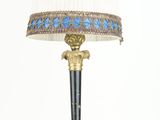 a lamp that is sitting on a table next to a lamp