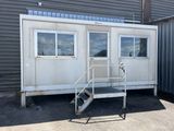 an image of a portable home with stairs and a ramp