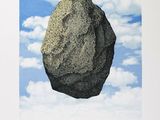 a picture of a rock in the middle of the ocean