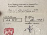 someone is holding a certificate with a stamp on it