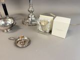 a silver tea set on a table next to a box of tea