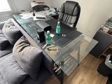 an image of a living room with a couch and a glass table