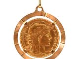 an image of a gold coin hanging from a rope