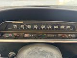 a car dashboard with a clock and a radio in it