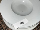a white plate with a name on it sitting on a counter
