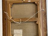 an old wooden easel with a piece of paper on top of it