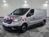 a silver van with red stripes parked in a room