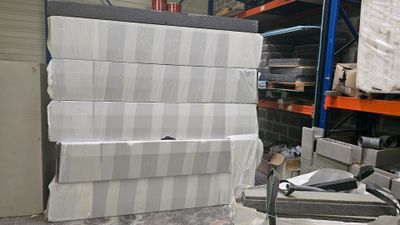 a stack of boxes sitting on a pallet in a warehouse