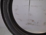 a close up of a tire tire on a white surface