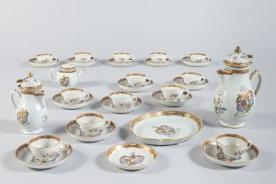 many different types of porcelain dishes and cups on the table