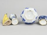 three different types of vases and a banana on the table