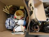 a cardboard box filled with many different types of items