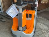 a forklift that is sitting in the garage