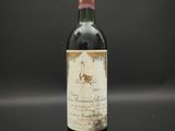 a bottle of wine that is sitting on a table