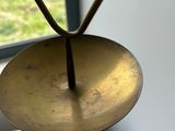 a metal object that has a triangle on top of it