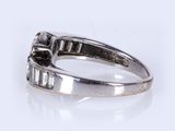 an image of a diamond ring on a white surface