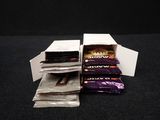 several packets of chocolate sitting in a box on a table