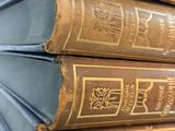 a stack of old books sitting on top of each other