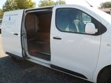 a white van with its doors open in a parking lot