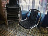 two chairs sitting next to each other in front of a window