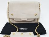 a white and black purse with a chain around it