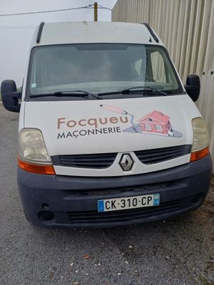 a white van that is parked on the side of the road