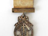 an image of a medal with a ribbon on a white surface