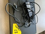 a laptop and a charger on a table