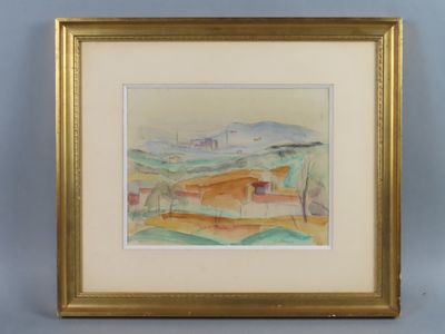 painting of a landscape in a gold frame on a blue wall