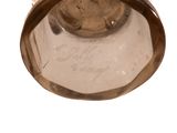a glass vase that is sitting on a table
